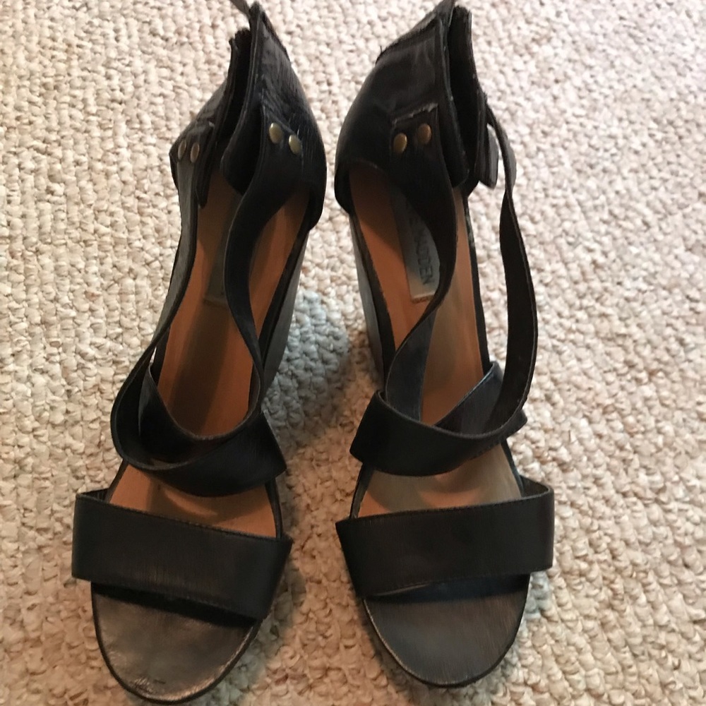 Black crisscrossed shoes from Steve Madden